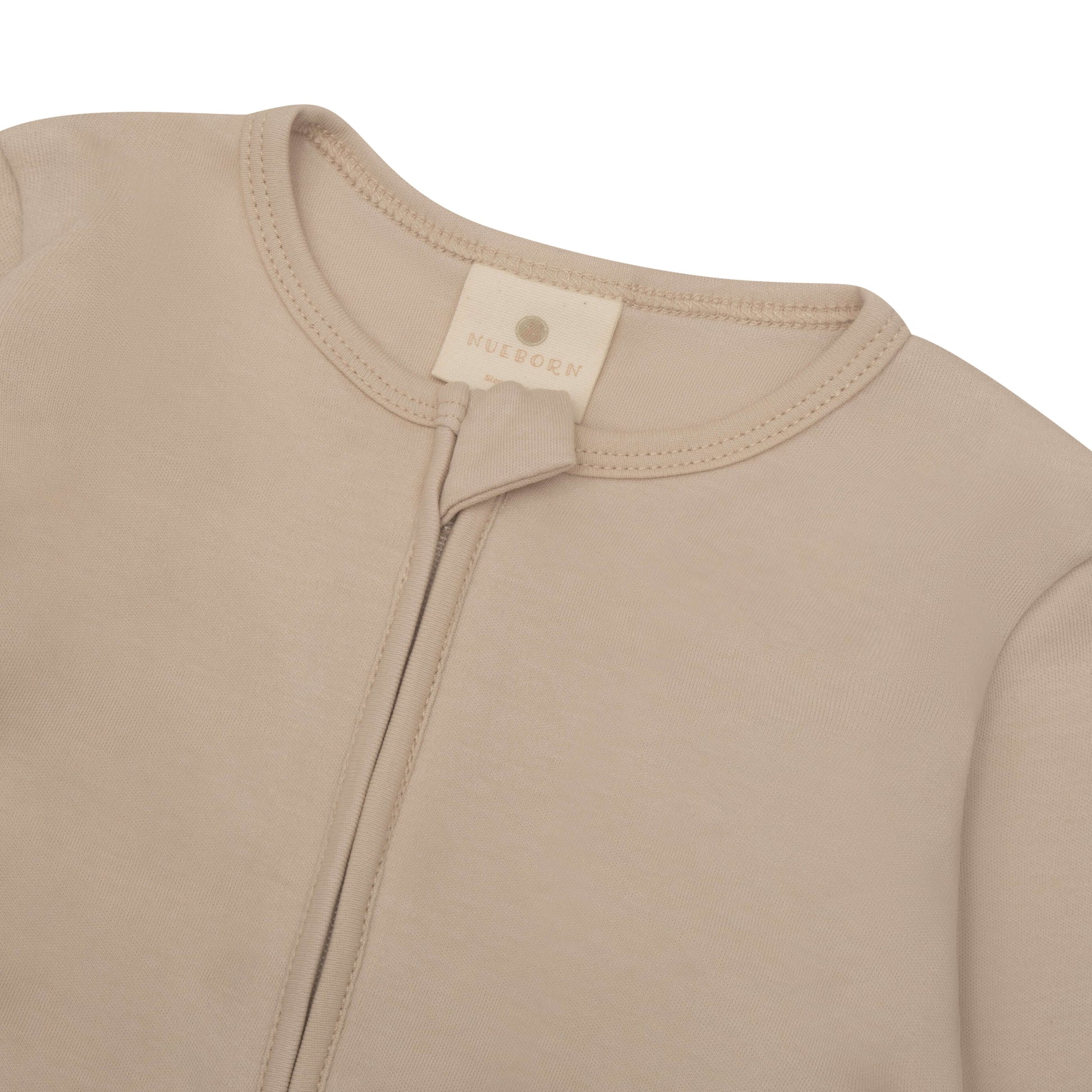 nueborn sleepsuit in Sandstone