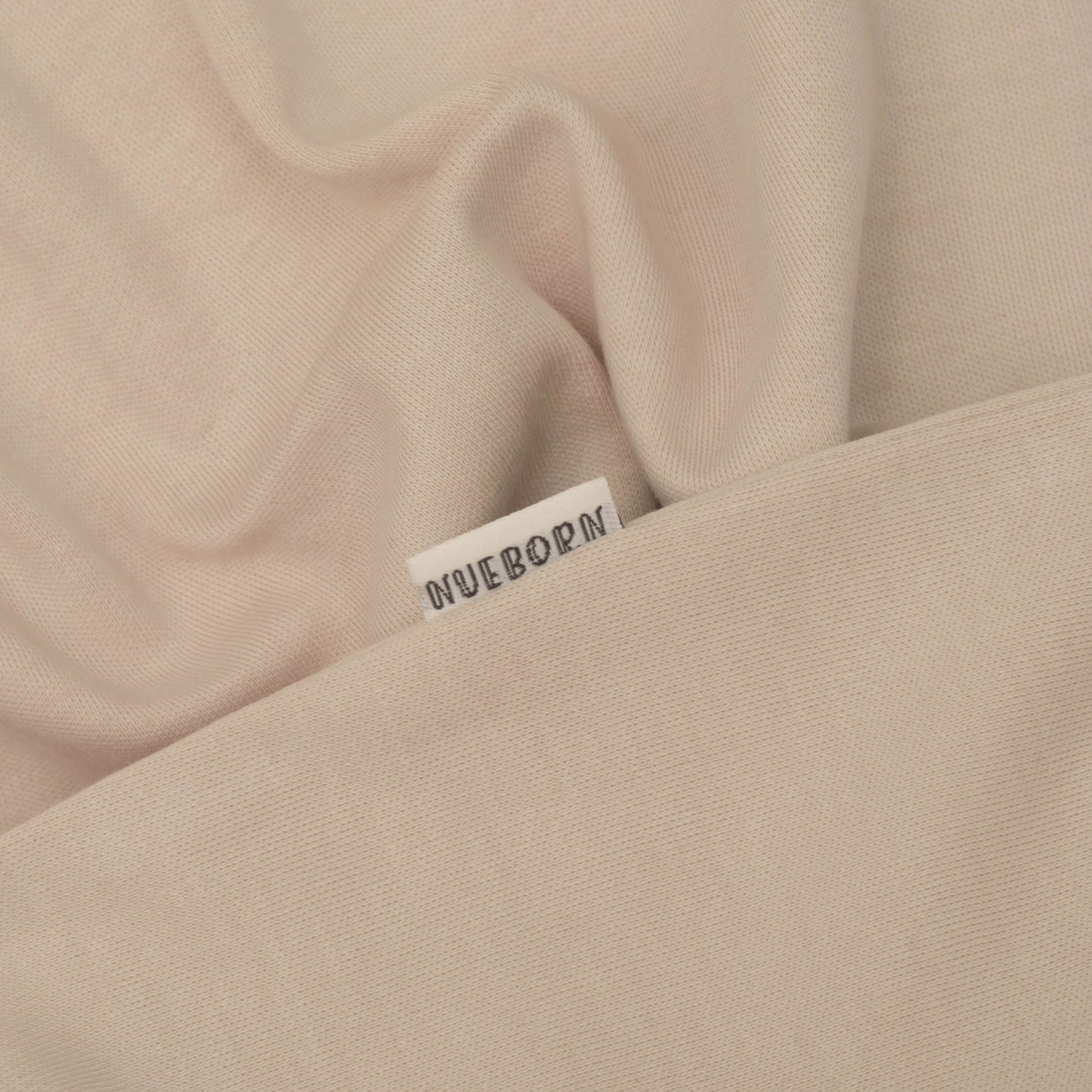 nueborn sleepsuit in Sandstone